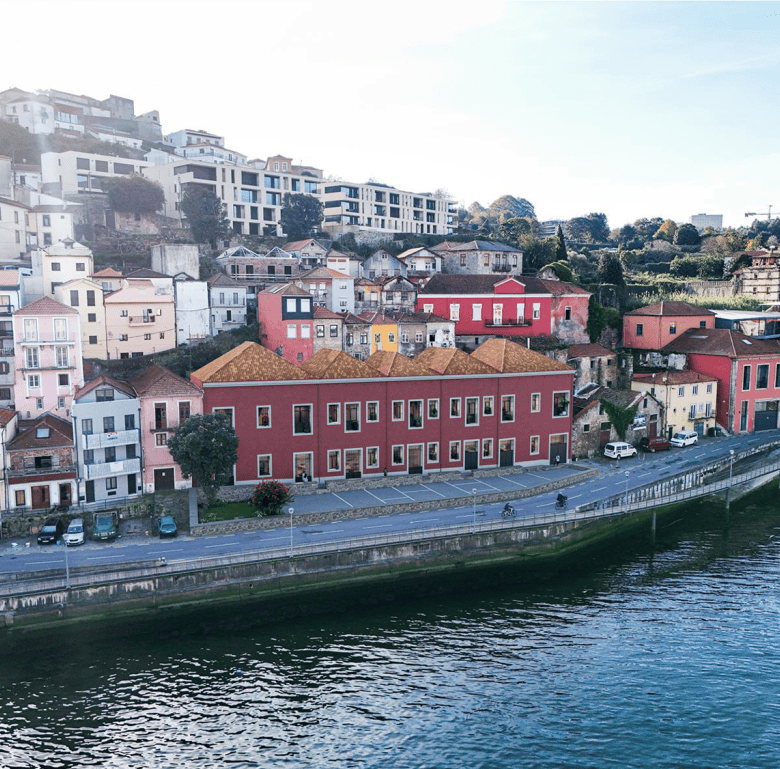 Porto Portugal colorful hillside houses by the river.