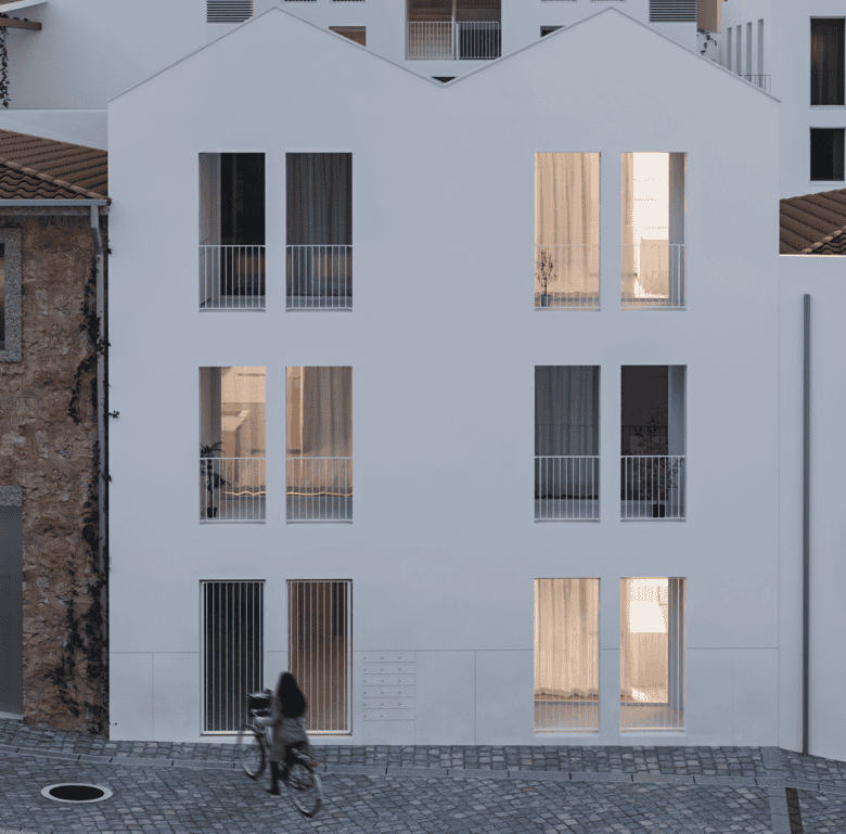 Contemporary Porto apartment with large windows and balconies, modern design.