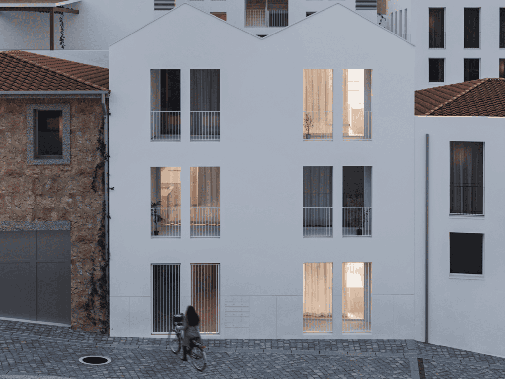 Contemporary Porto apartment with large windows and balconies, modern design.