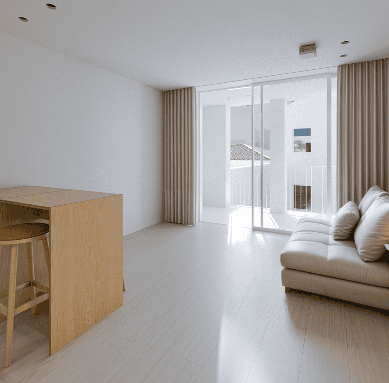 Bright living room with large glass doors opening to balcony in Porto, Portugal.