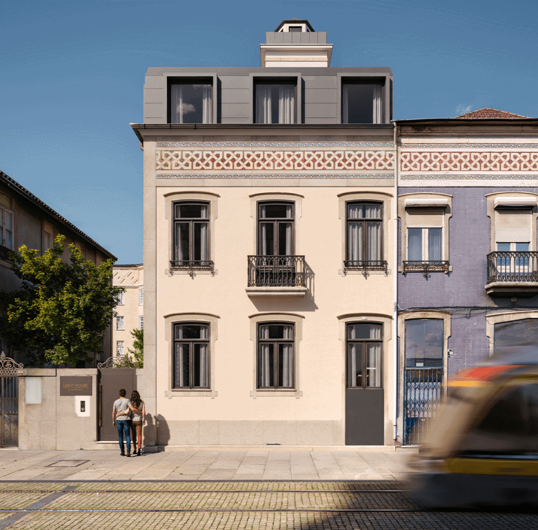 Lighthouse building in Matosinhos, Portugal, with classic architecture and modern rooftop extension.