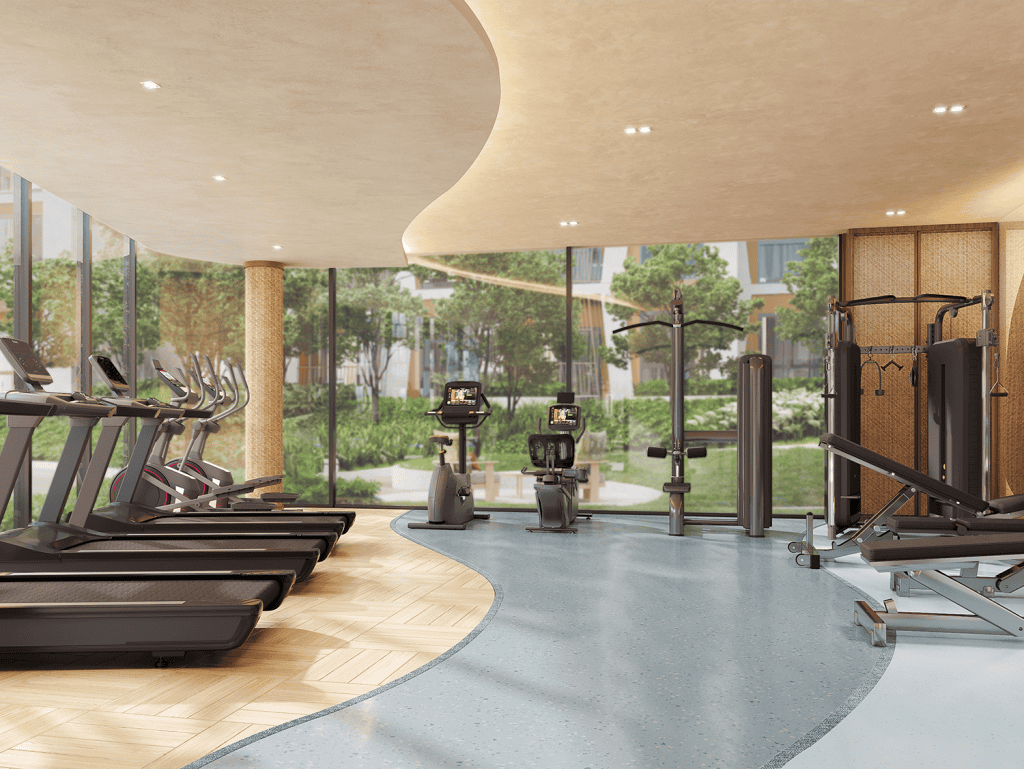 Gym interior with treadmills, exercise bikes, and weight machines in Phuket, Thailand.