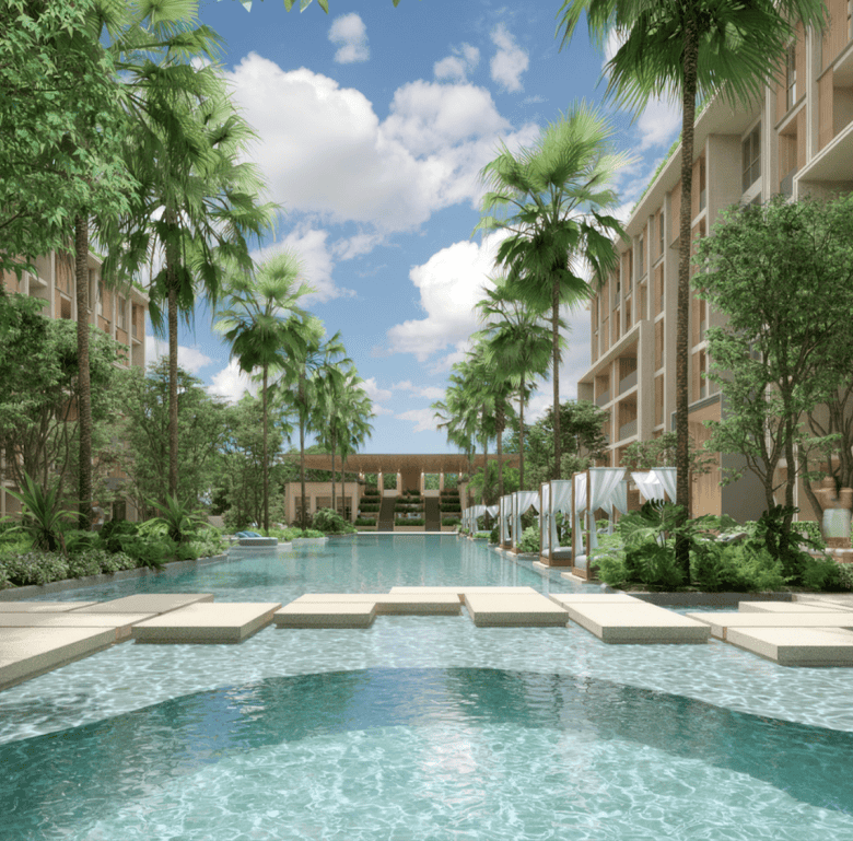 Beautiful swimming pool with lush greenery at Sudara, Phuket, Thailand.