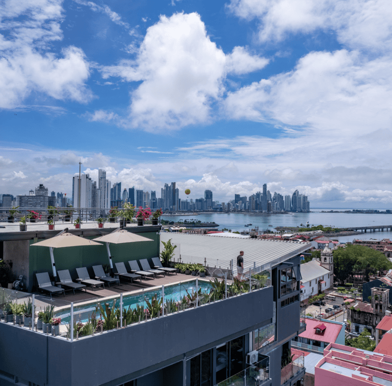 Panama City skyline view from Casco View rooftop pool with cityscape and ocean backdrop.