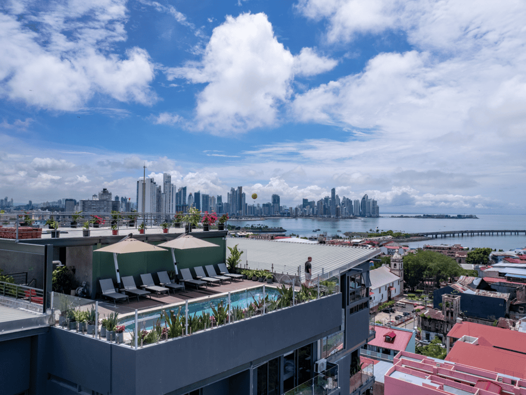 Panama City skyline view from Casco View rooftop pool with cityscape and ocean backdrop.