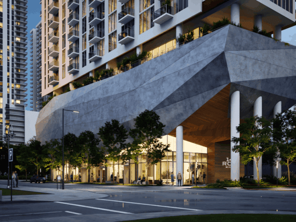 Luxury Miami residential building with modern architecture and retail spaces.