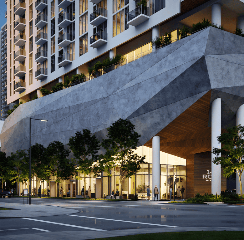 Luxury Miami residential building with modern architecture and retail spaces.