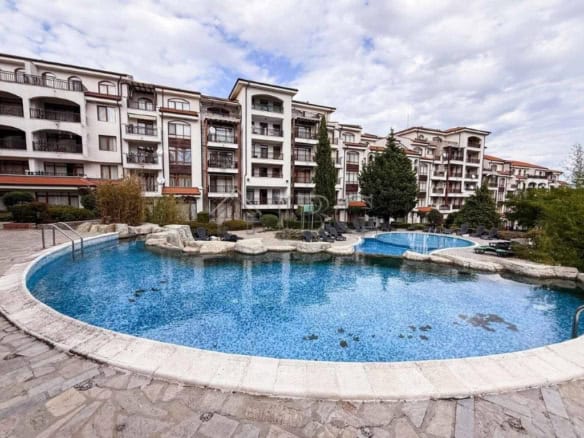 Apartment complex with pool and lush surroundings in Aheloy, Bulgaria.