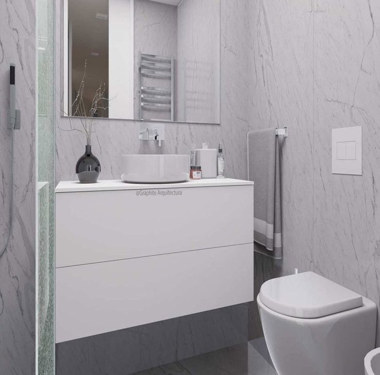 Bathroom with contemporary design, marble walls, and modern amenities in Viana do Castelo, Portugal.