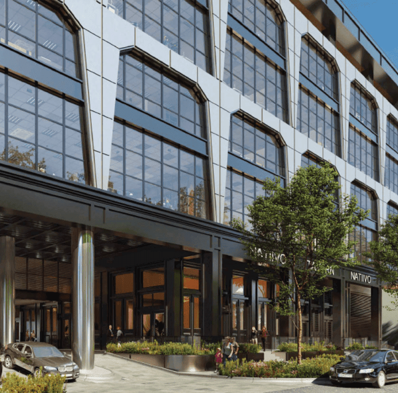 Modern office building in Fort Lauderdale, USA with glass facade and urban landscaping.