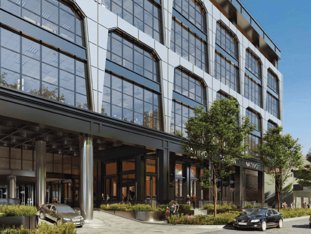 Modern office building in Fort Lauderdale, USA with glass facade and urban landscaping.