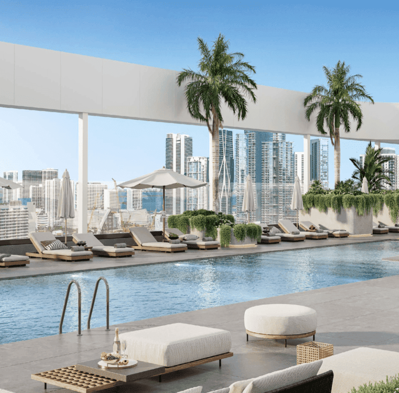 Luxury Miami rooftop pool with city skyline view and lounging area.