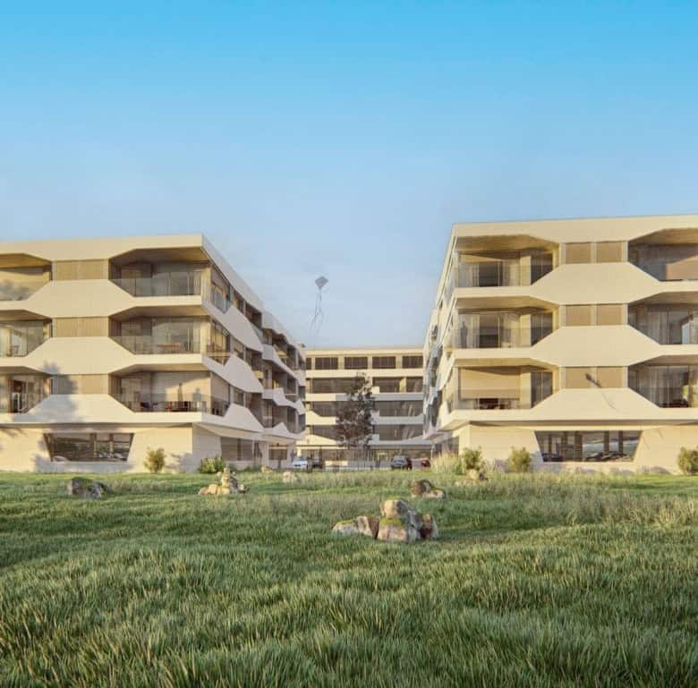 Modern apartment complex in Viana do Castelo, Portugal, with spacious balconies and lush green surro.