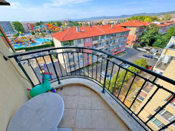 Balcony view of Sunny Beach with aquapark and surrounding buildings.