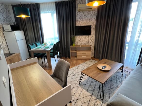 Modern studio apartment in Ipanema Beach Complex, Saint Vlas, featuring a living area, dining space,.