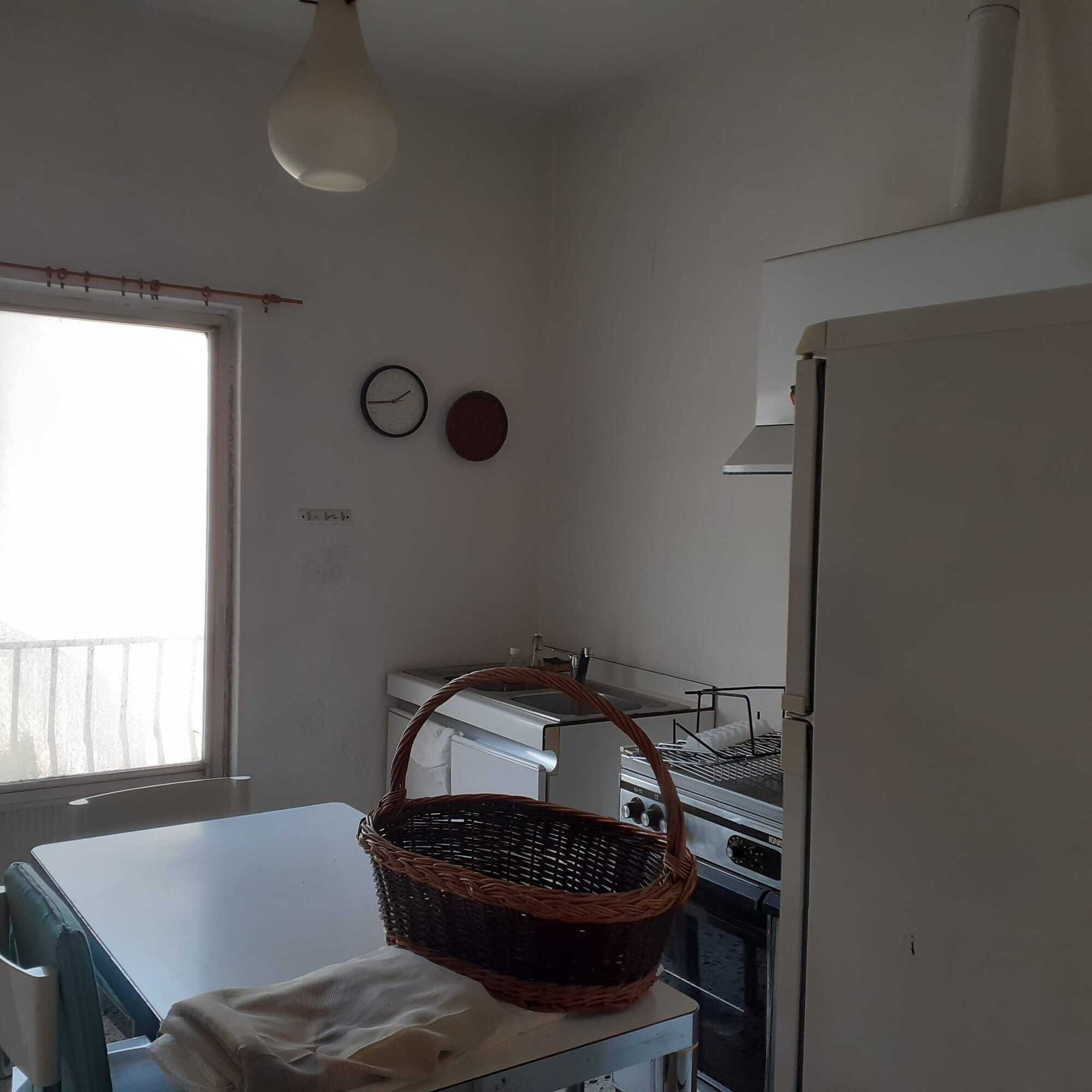 Interior view of a renovated 3-bed apartment kitchen in Calangianus, Sardinia, Italy.