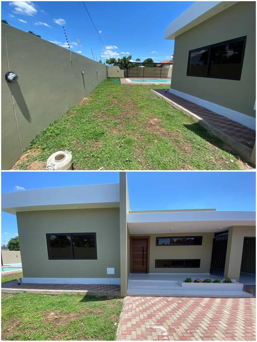 Spacious backyard with well-maintained grass, fencing, and modern house design.