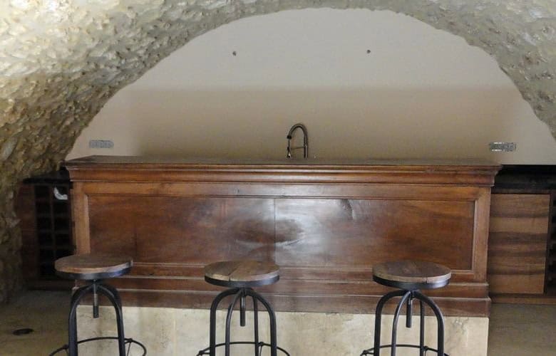 Interior view of the rustic bar area in the Domaine de La Quiquier estate, Goudargues, France.
