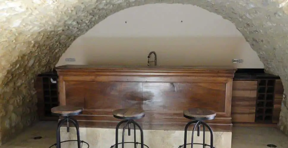 Interior view of the rustic bar area in the Domaine de La Quiquier estate, Goudargues, France.