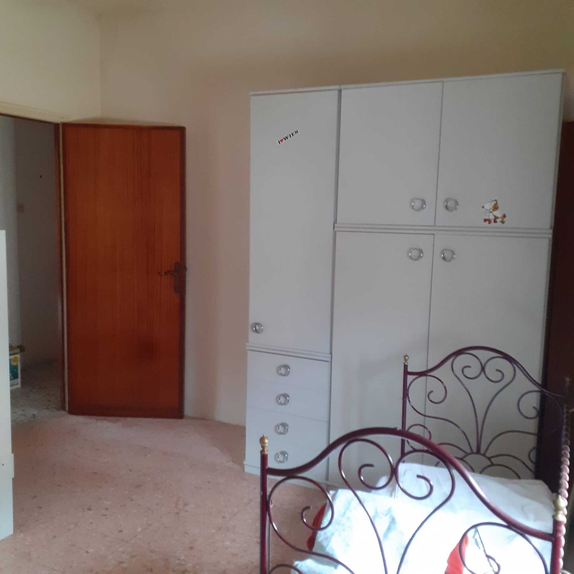 Interior view of a renovated 3-bedroom apartment in Calangianus, Sardinia, Italy.