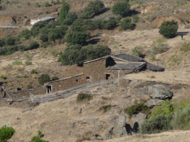 Country estate with rustic stone buildings in Caniles, Granada, surrounded by natural landscape and.