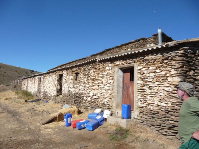 Rustic stone country estate in Caniles, Granada with traditional architecture and scenic surrounding.