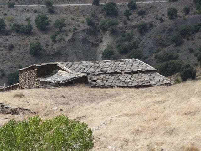 Rustic country estate with traditional stone buildings in Caniles, Granada, set in a scenic rural la.