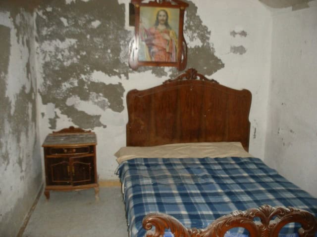 Unique cave house in Gorafe, Granada with rustic interior and traditional decor.