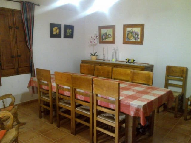 Interior view of a traditional cave house dining area in Cortes de Baza, Granada.