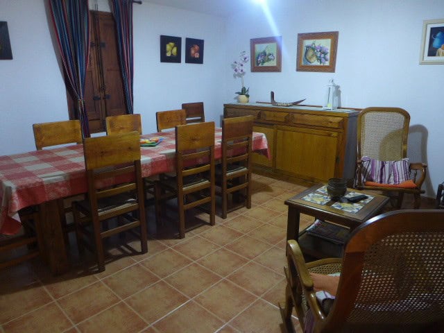 Cave House in Cortes de Baza, Granada with rustic dining room and wooden furniture.