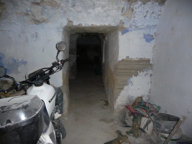 Entrance to rural property in Benamaurel, Granada with rustic interior and old equipment.