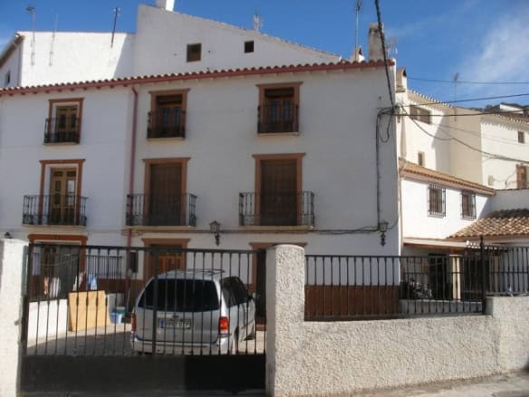 Village property for sale in Benamaurel, Granada, featuring traditional architecture and a private c.