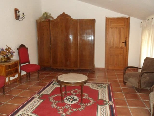 Charming village home in Benamaurel, Granada with traditional decor and spacious living area.