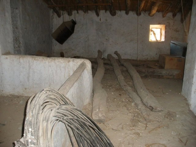 Charming rustic interior of a village property in Venta del Peral, Granada, with wooden beams and na.