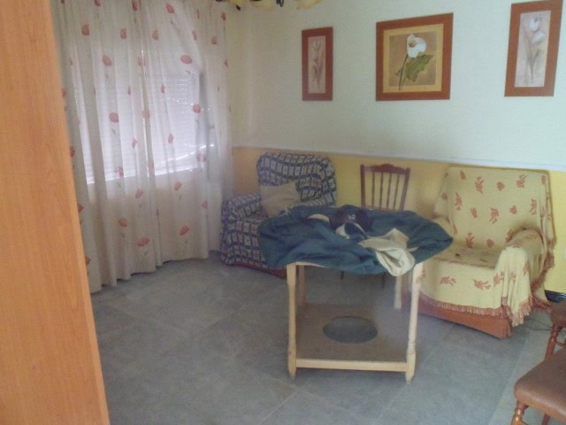 Village property interior with sofas and artwork in Cortes de Baza, Granada.