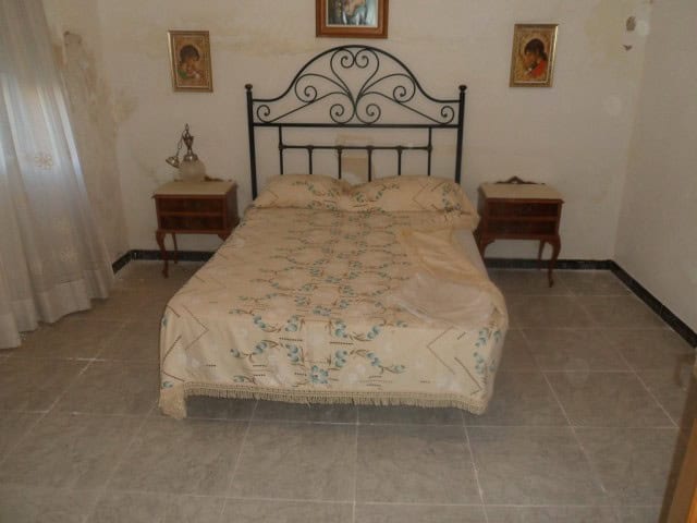 Cozy bedroom in a village property located in Cortes de Baza, Granada, featuring traditional decor a.