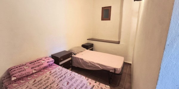Cozy bedroom in a traditional village property in Cuenca, Jaen, Spain. Ideal for those seeking authe.