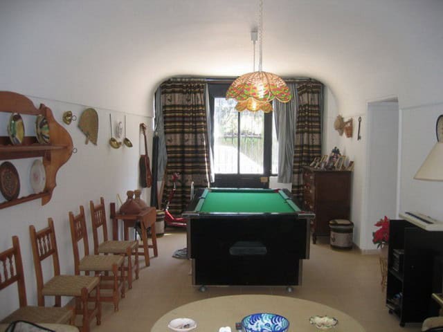 Pool table in a cozy farm house living room in Cullar, Granada.