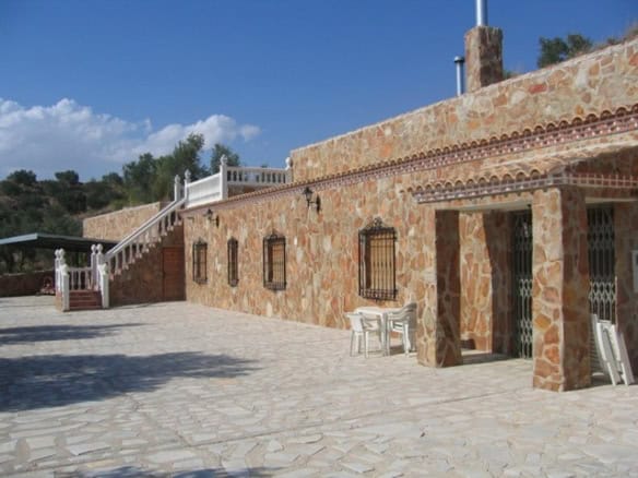 Farmhouse with stone exterior in Cullar, Granada, Spain.