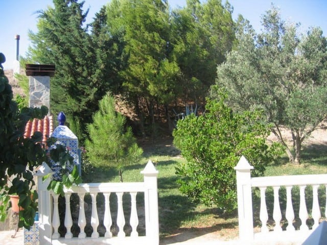 Farm property with lush greenery and mature trees in Cullar, Granada.