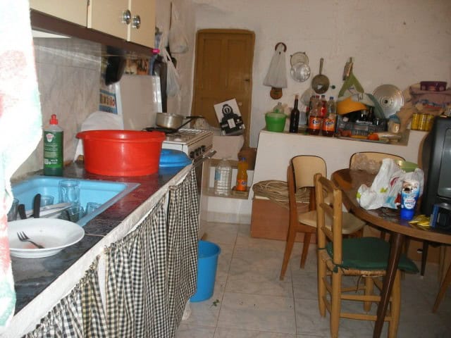 Rural property kitchen in Velez Blanco, Almeria with rustic decor, wooden furniture, and traditional.