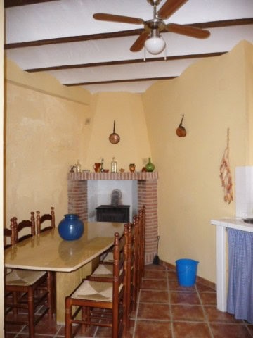 Charming village home interior with rustic decor and traditional fireplace.