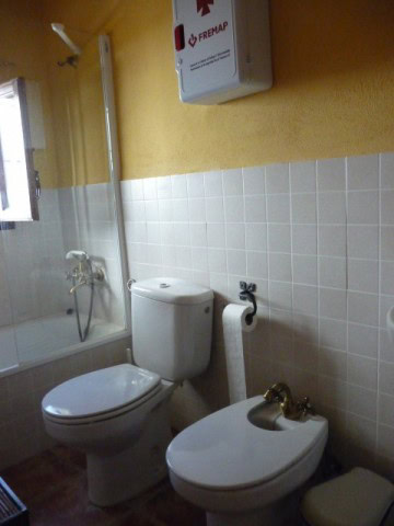 Cozy bathroom with toilet and bidet in Belerda village, Jaen, Spain.