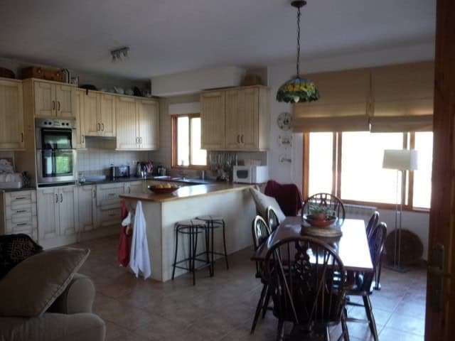 Charming kitchen and dining area in a rural property in Castril, Granada, with natural light and coz.