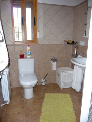 Charming rural property bathroom in Castril, Granada with modern fixtures and natural light.