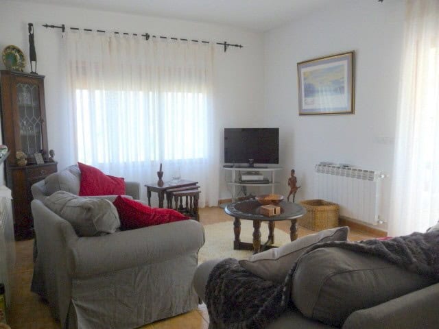 Charming living room with comfortable sofas, a TV, and natural light in a rural property in Castril,.