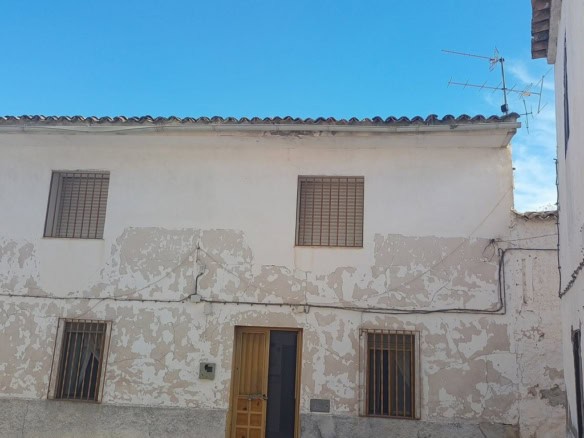 Charming village house in Larva, Jaen, with rustic exterior and traditional features.