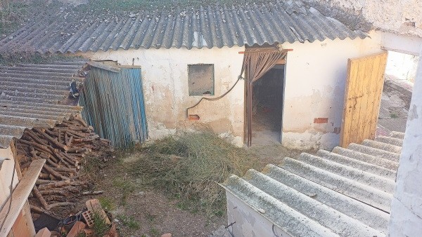 Charming village property in Larva, Jaen, featuring rustic walls and traditional roofing, ideal for.