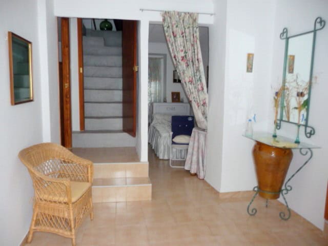 Beautiful interior of a village home in Belerda, Jaen, featuring cozy furnishings and traditional de.