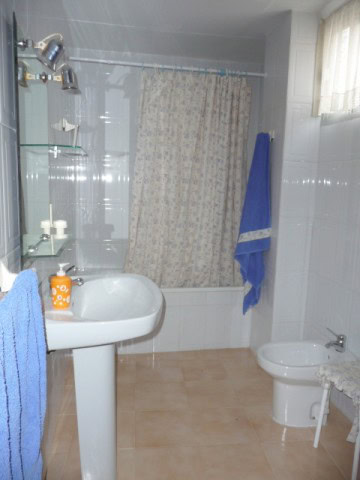 Bathroom with sink, bidet, and shower in village property in Belerda, Jaen, Spain.